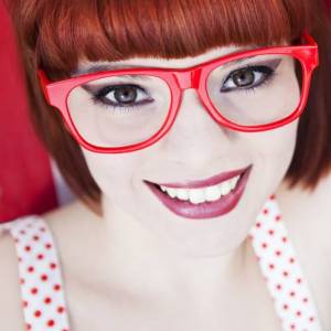 bigstock_Cheerful_red_haired_girl_15330950
